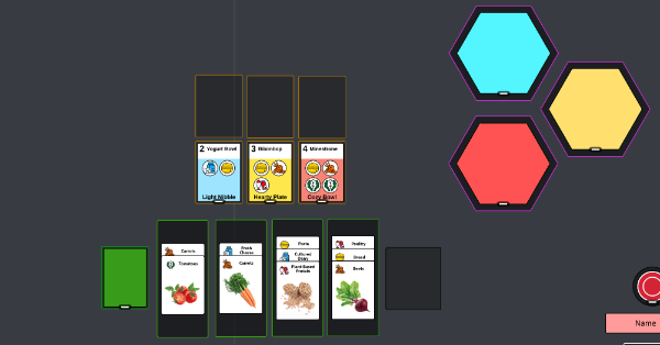 Four stacks of ingredient cards, three stacks of recipe cards, and 3 face down piles of hexagon tiles.